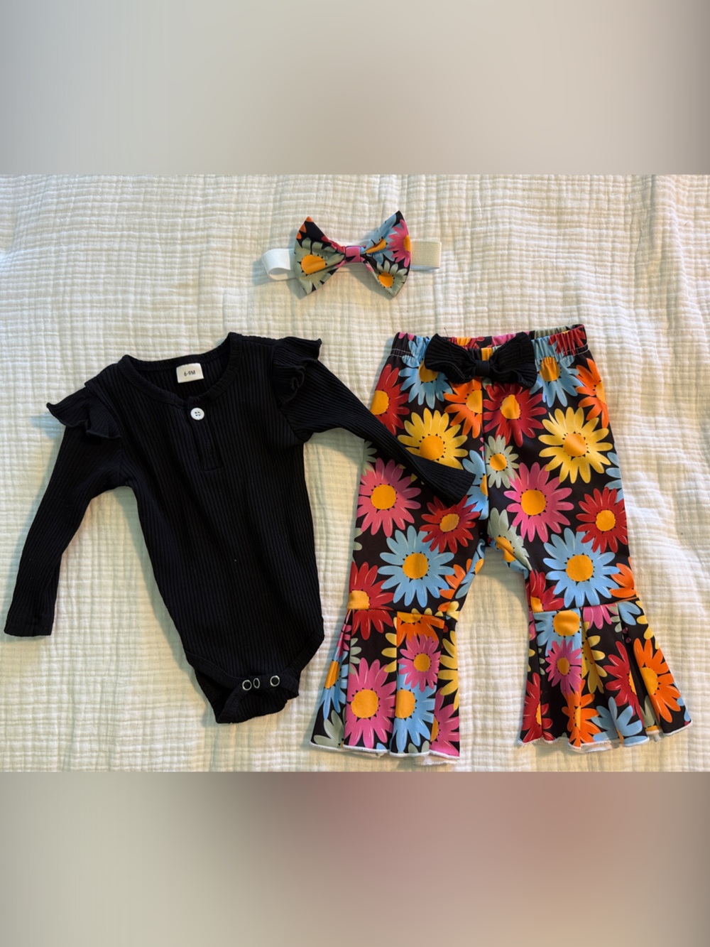 Black Ribbed Baby Bodysuit with Multicolor Floral Flared Pants Set
